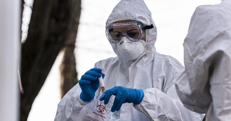 Person in a hazmat suit. Coronavirus: Newborn baby becomes youngest US victim of COVID-19