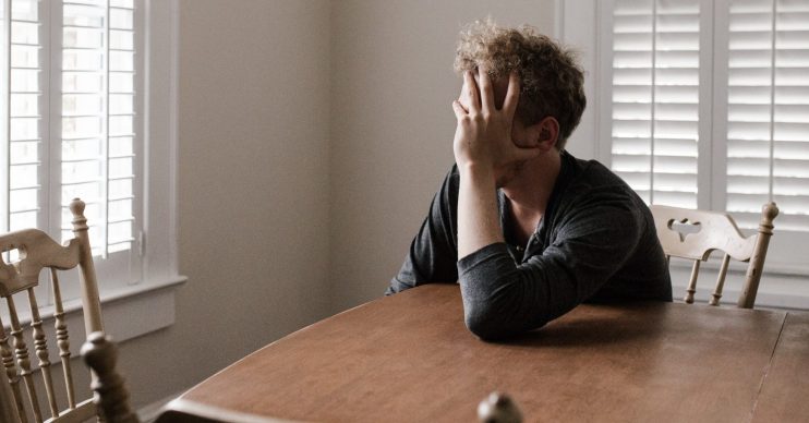 Man sitting at a table. Coronavirus: Latest on when Government will update us on lockdown – and what is likely to happen
