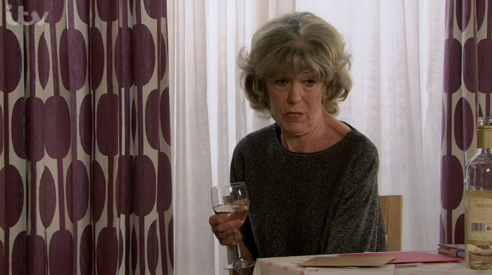 Audrey Roberts in Coronation Street looks sad as she drinks wine