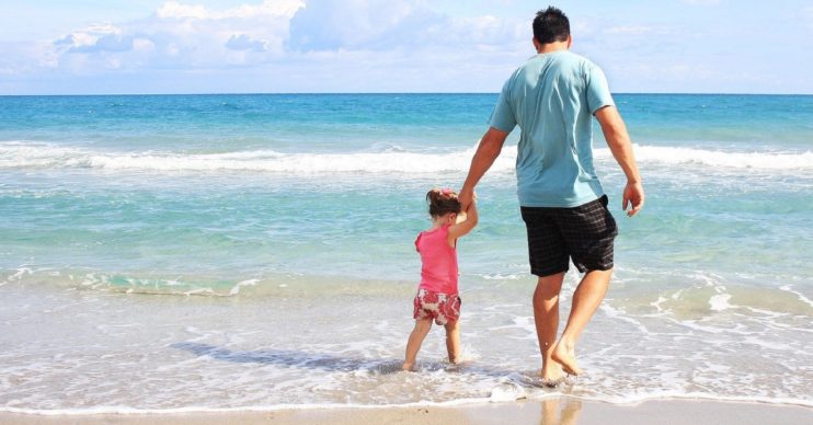 Father and daughter on a beach