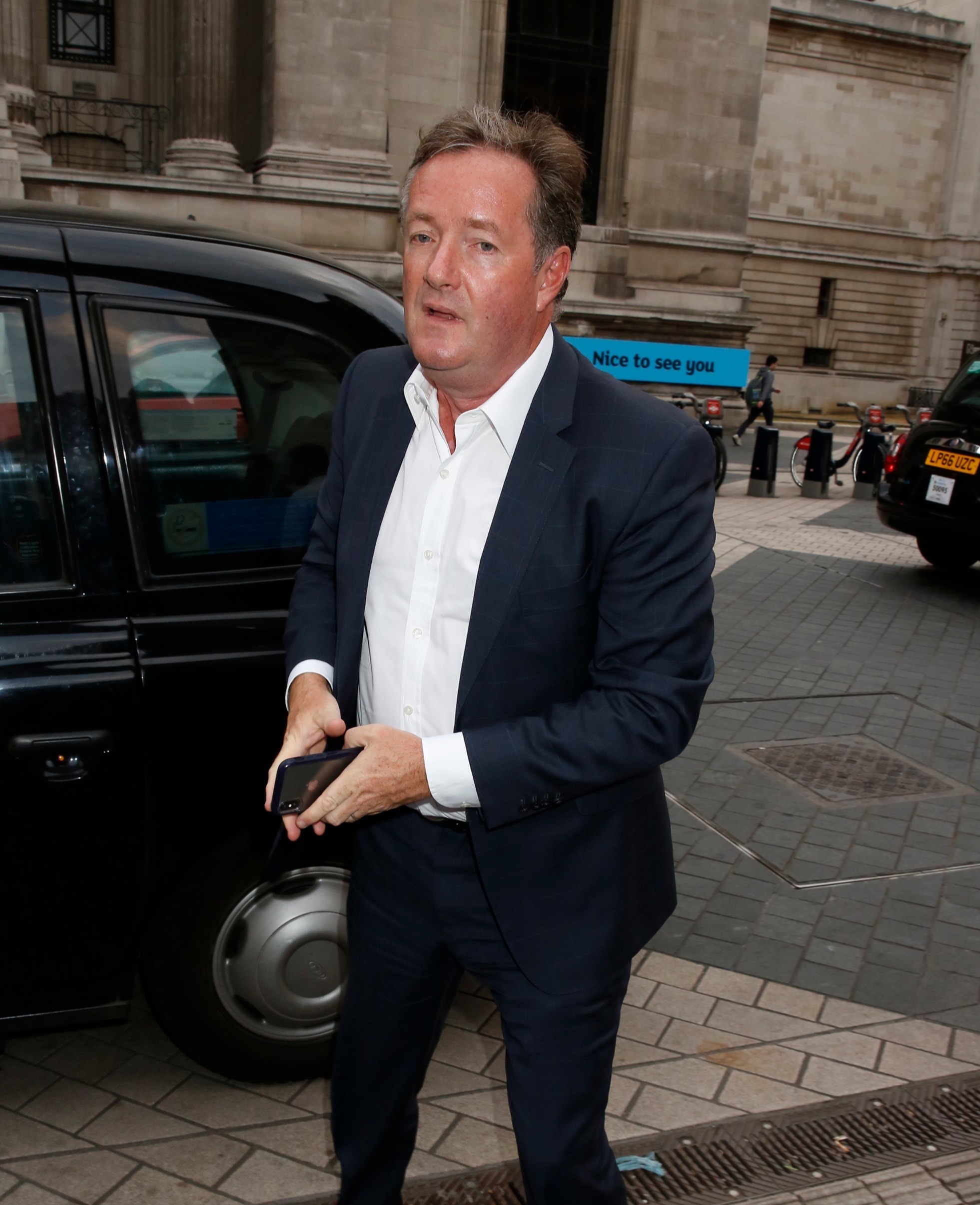 Piers Morgan was proud that Sir Captain Tom Moore received a knighthood (Credit: Splash News)