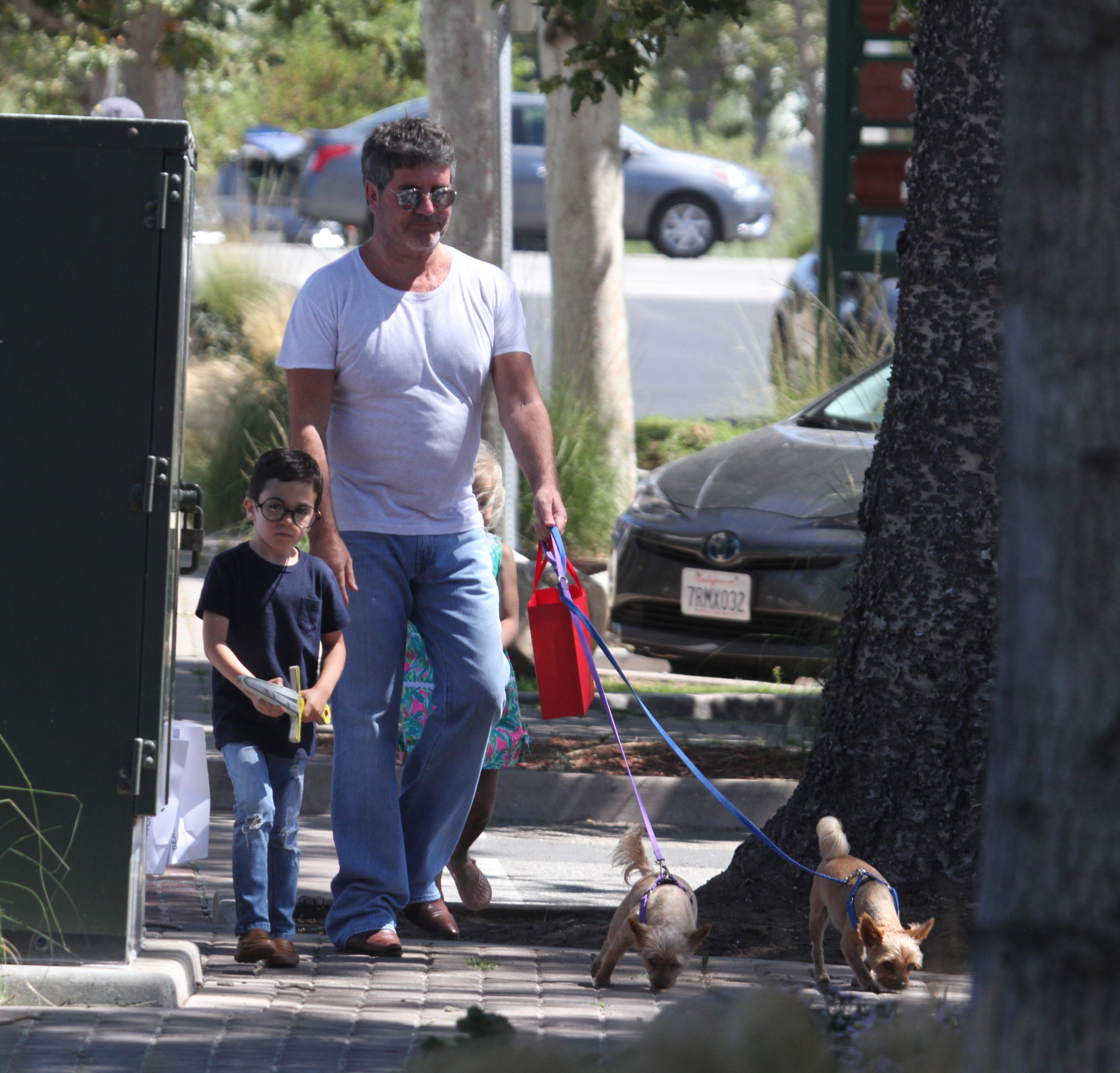Simon Cowell Making Funny Faces with dogs and family.