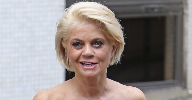 Dannielle Westbrook smiles as she poses in a strapless top