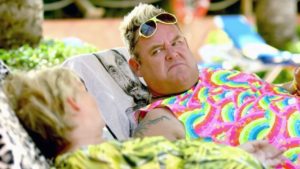  Benidorm scene with two people on sun loungers