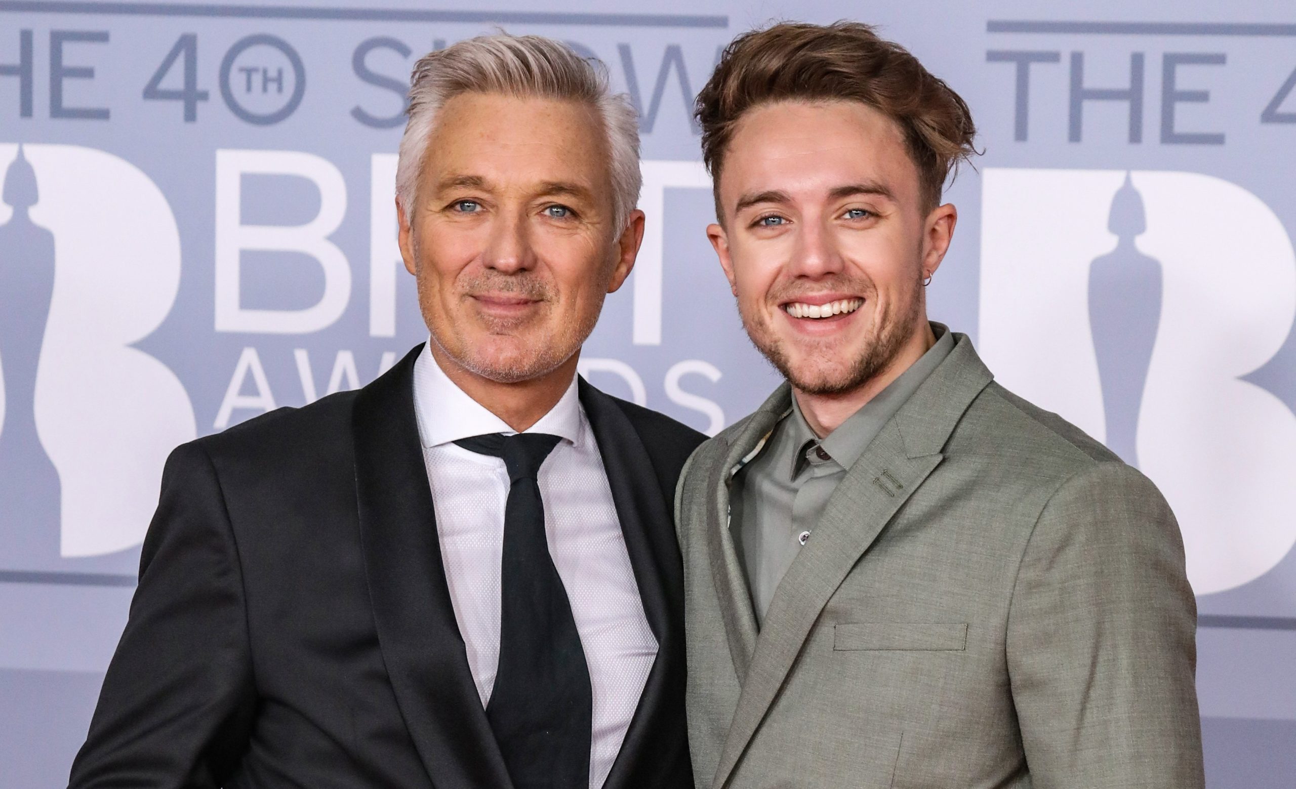 Martin Kemp posing at the Brit Awards with son Roman