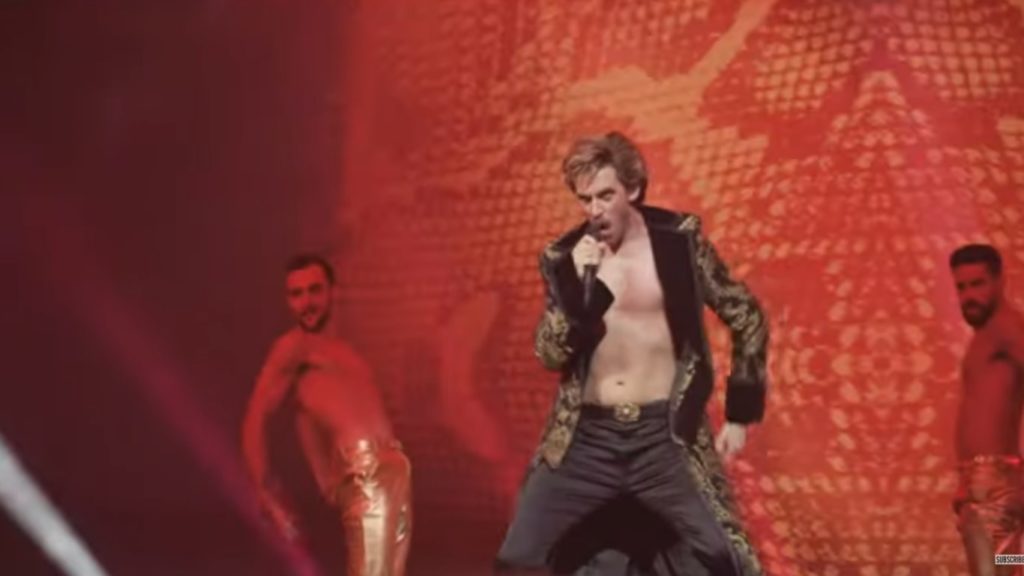 Dan sings the song Lion of Love in the Eurovision movie (Credit: Netflix)