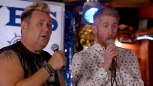 Benidorm scene with two stars doing karaoke