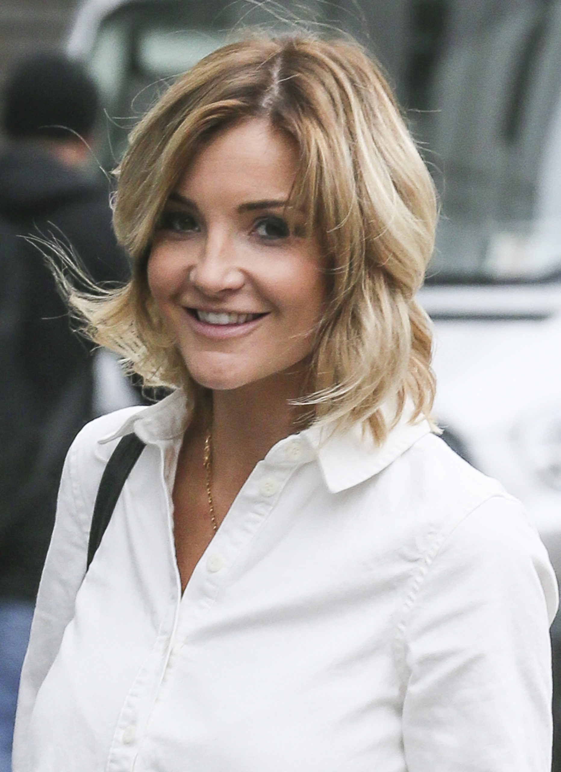 Helen Skelton smiles in a white shirt