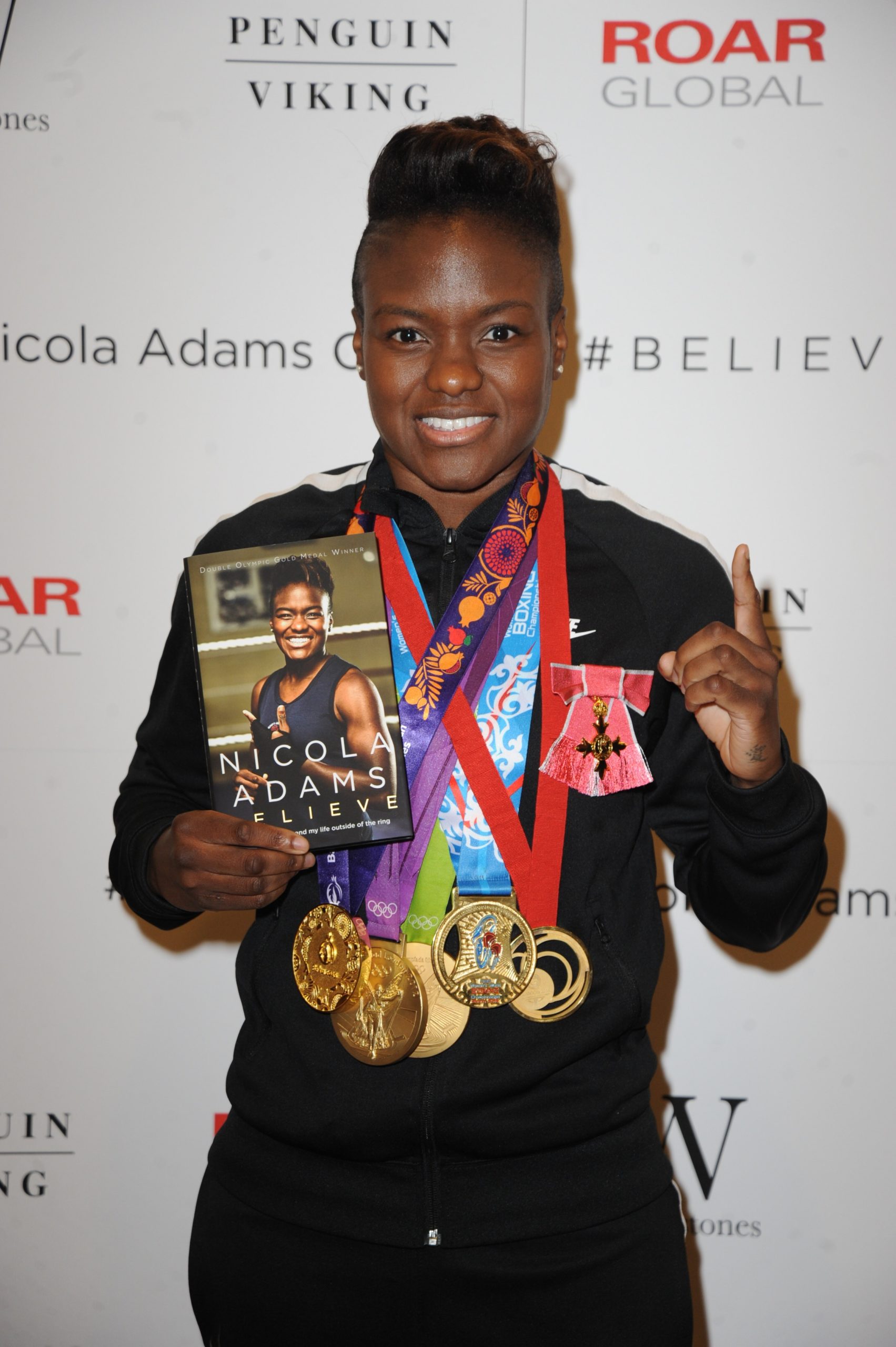 Nicola Adams displays her boxing medals 