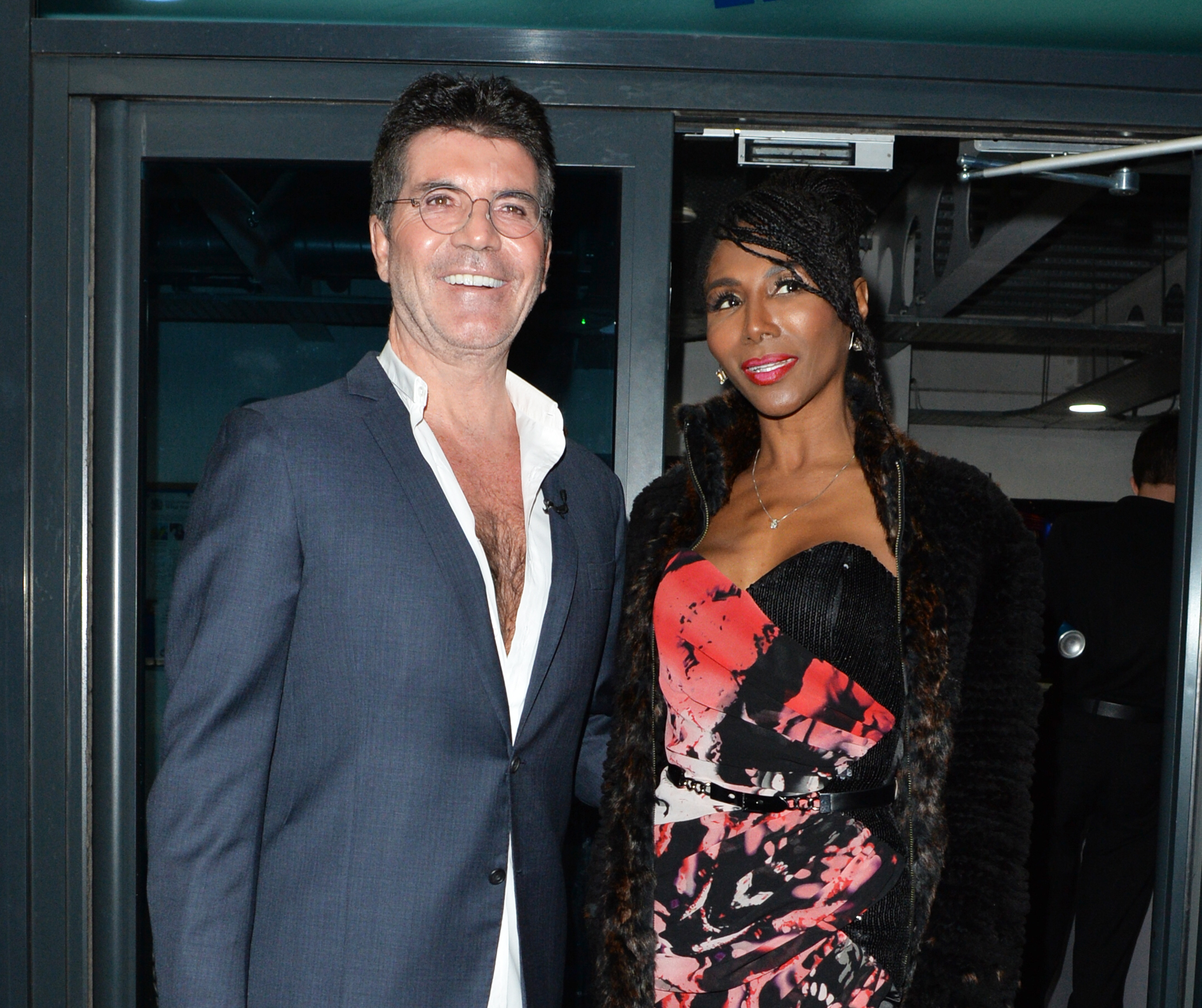 Simon Cowell, who injured his back, and Sinitta