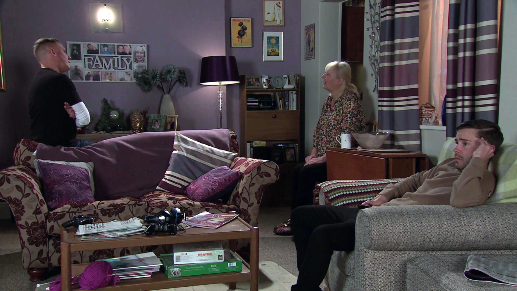 Sean, Eileen and Todd sit in the very purple living room of No.11 Coronation Street