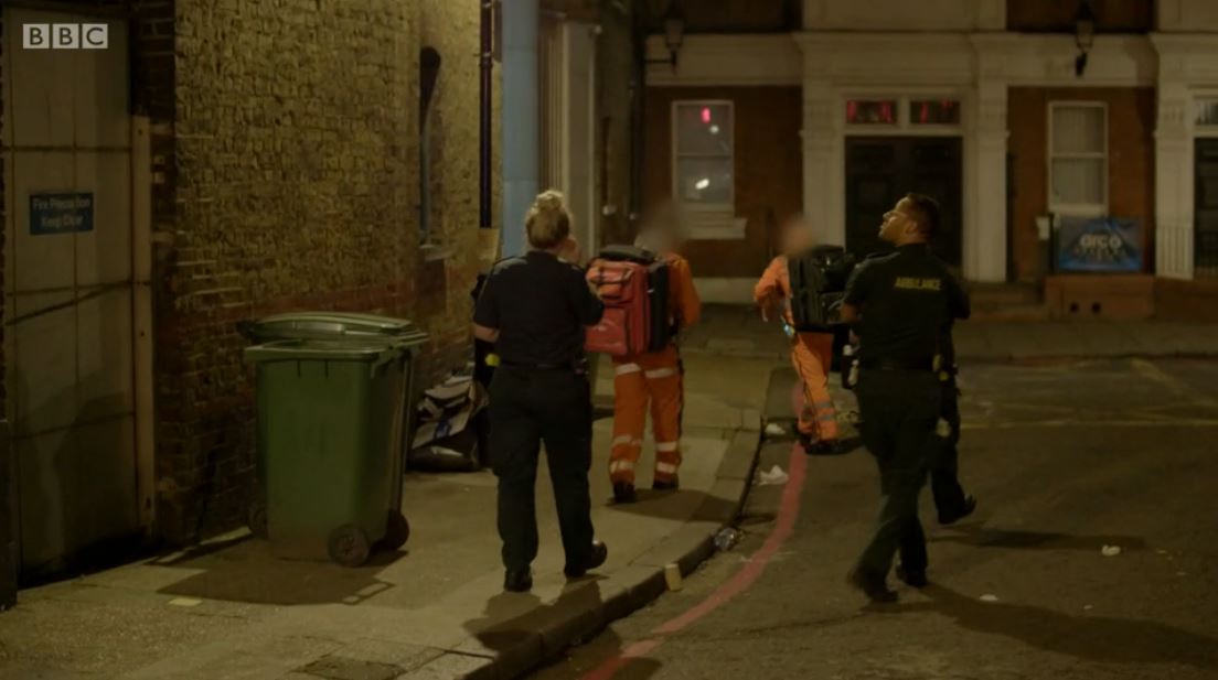 Paramedics on Ambulance walking down a street