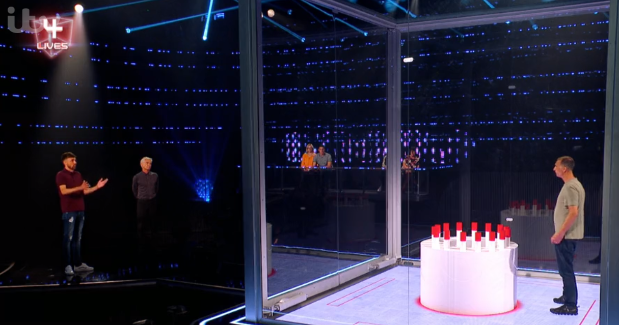 Adam speaking to son Rhys and host Phillip Schofield on The Million Pound Cube
