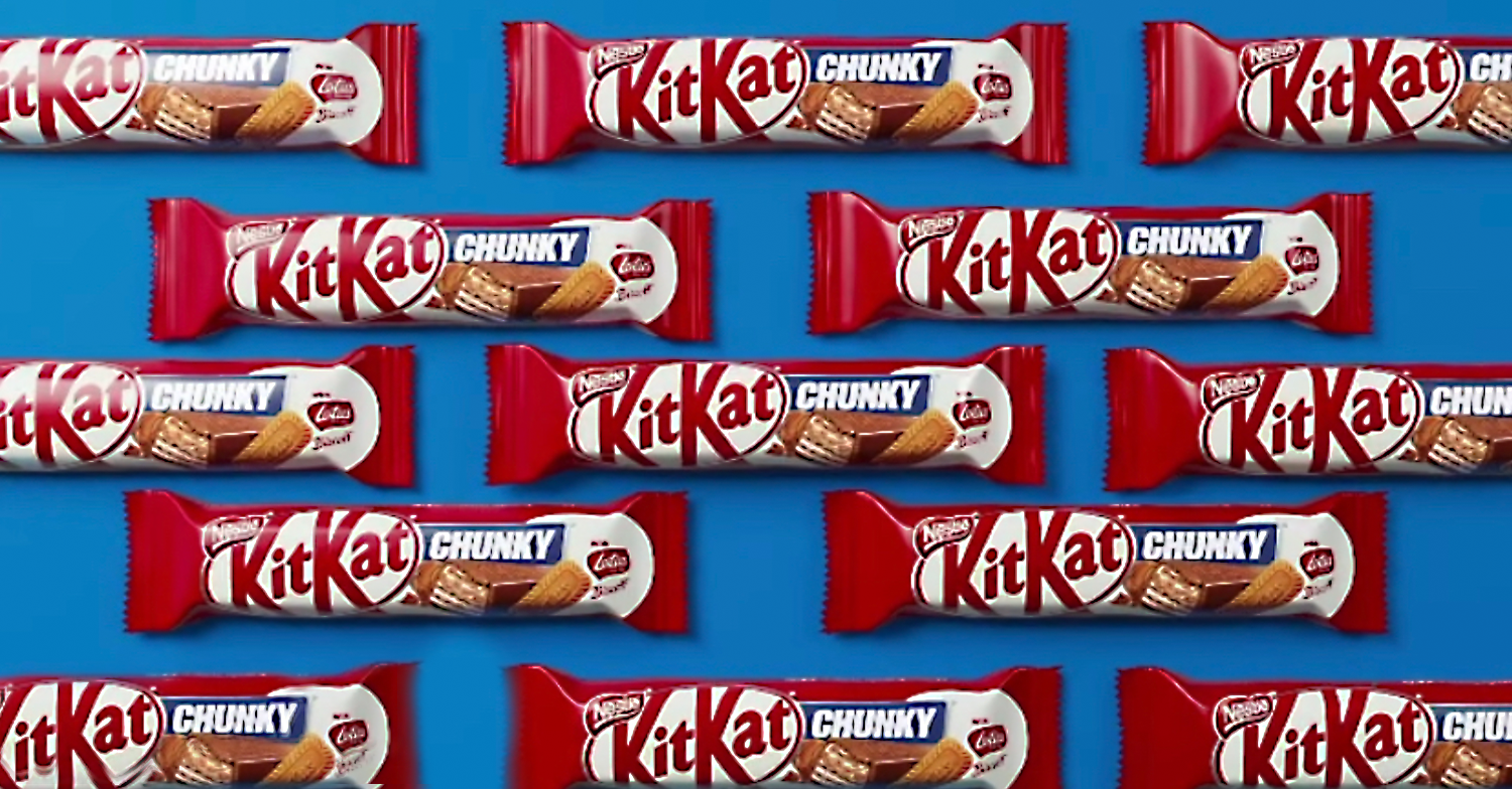 montage of KitKat chunky biscoff bars on blue background