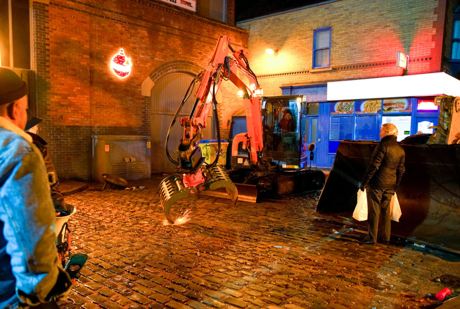The long arm smashes a nearby substation in Coronation Street