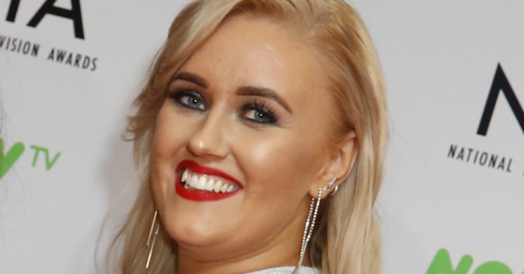 Ellie Warner smiling on the red carpet at the NTAs