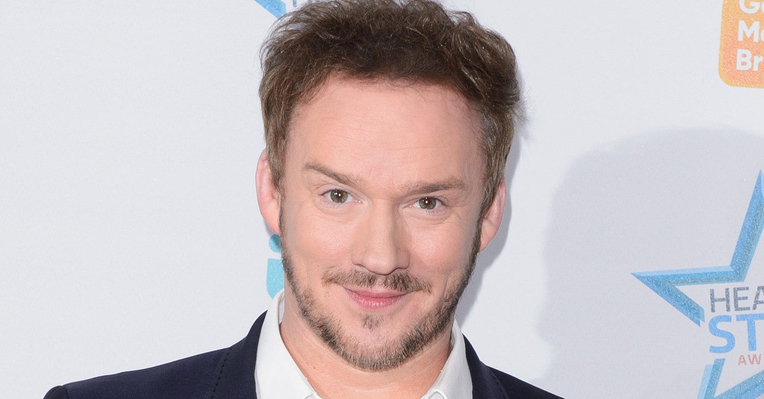 Russell Watson smiling eyes to camera