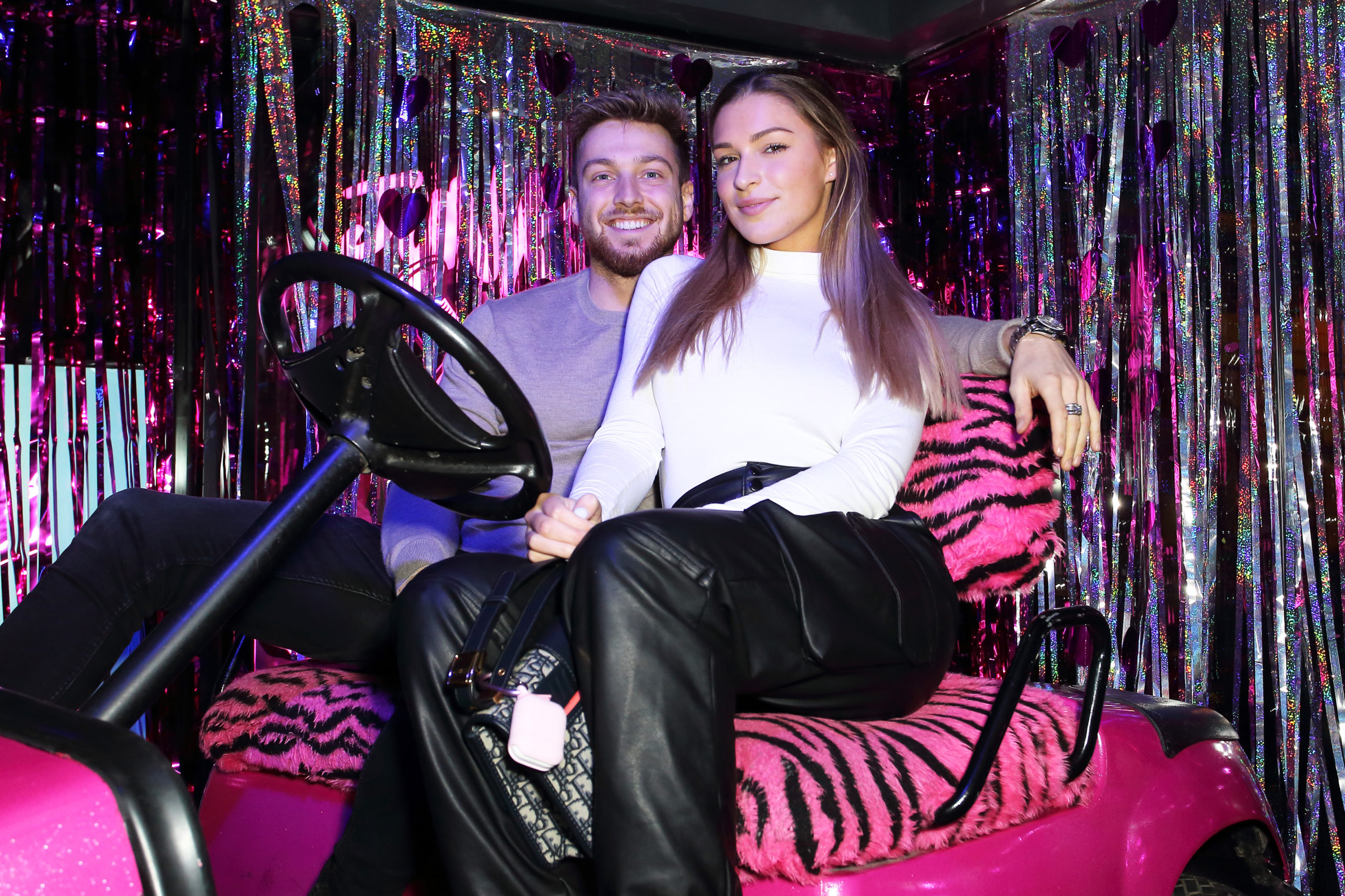 Sam Thompson cuddling Zara McDermott on a night out