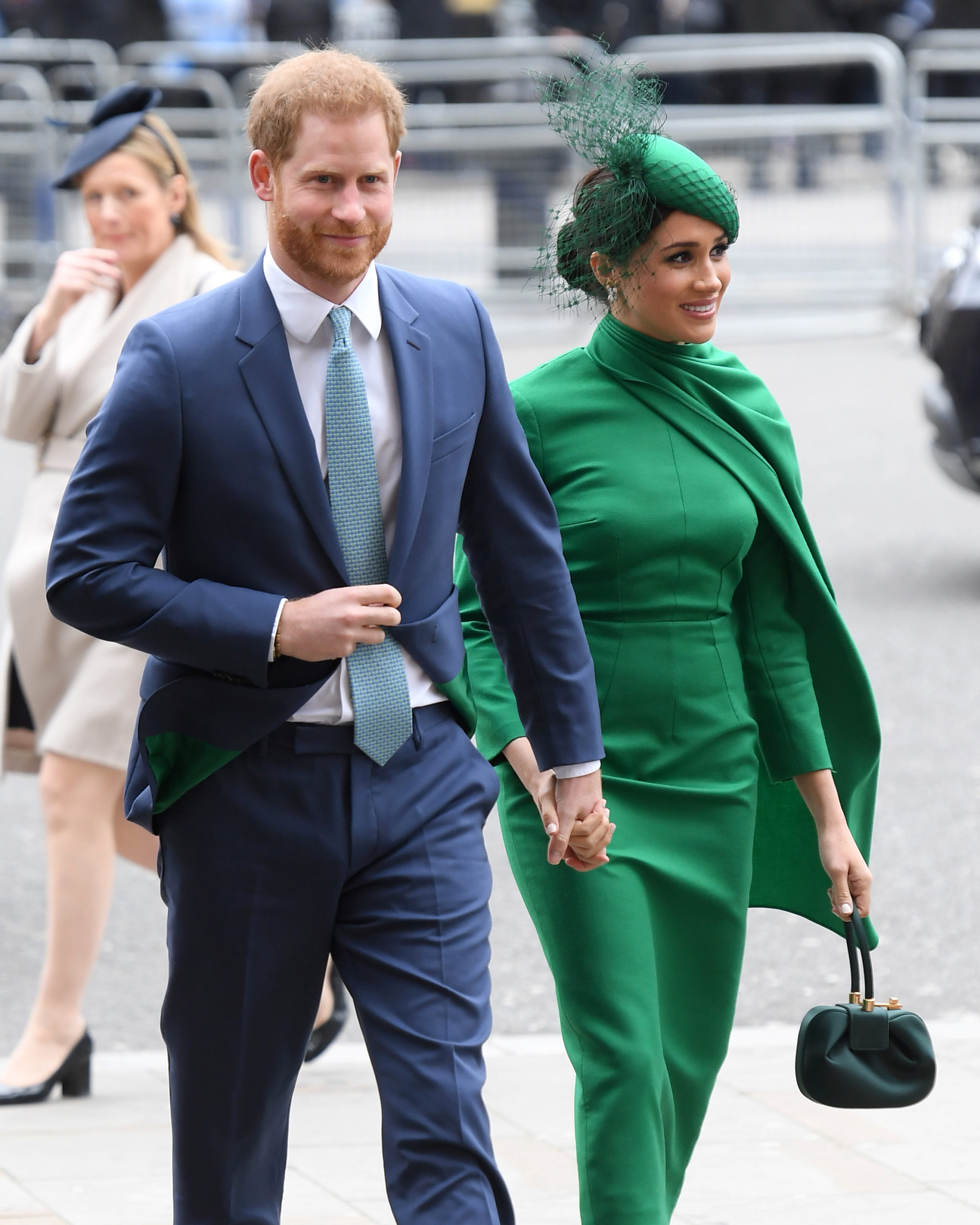 Prince Harry holding Meghan's hand