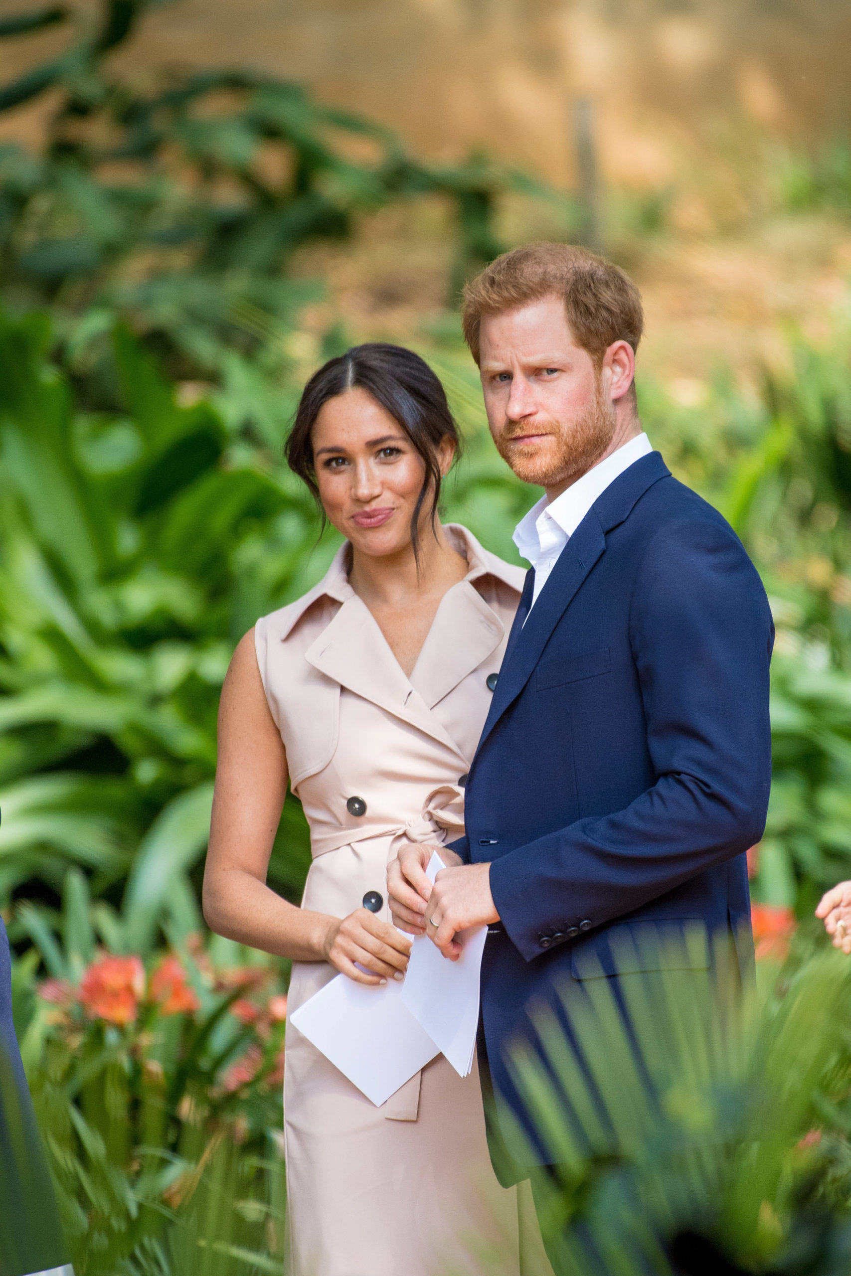 harry and meghan posing for a photograph