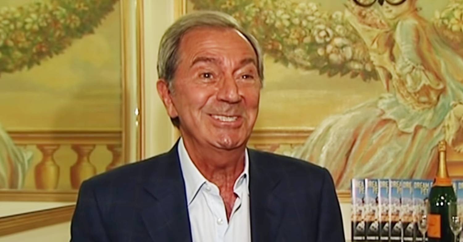 Des O'Connor smiling in an interview