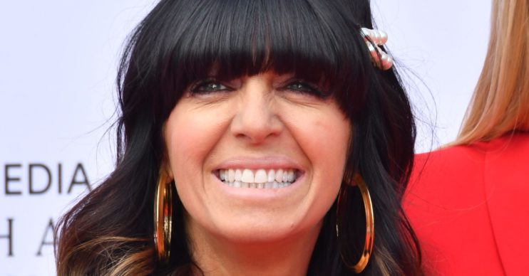Claudia Winkleman smiles on red carpet
