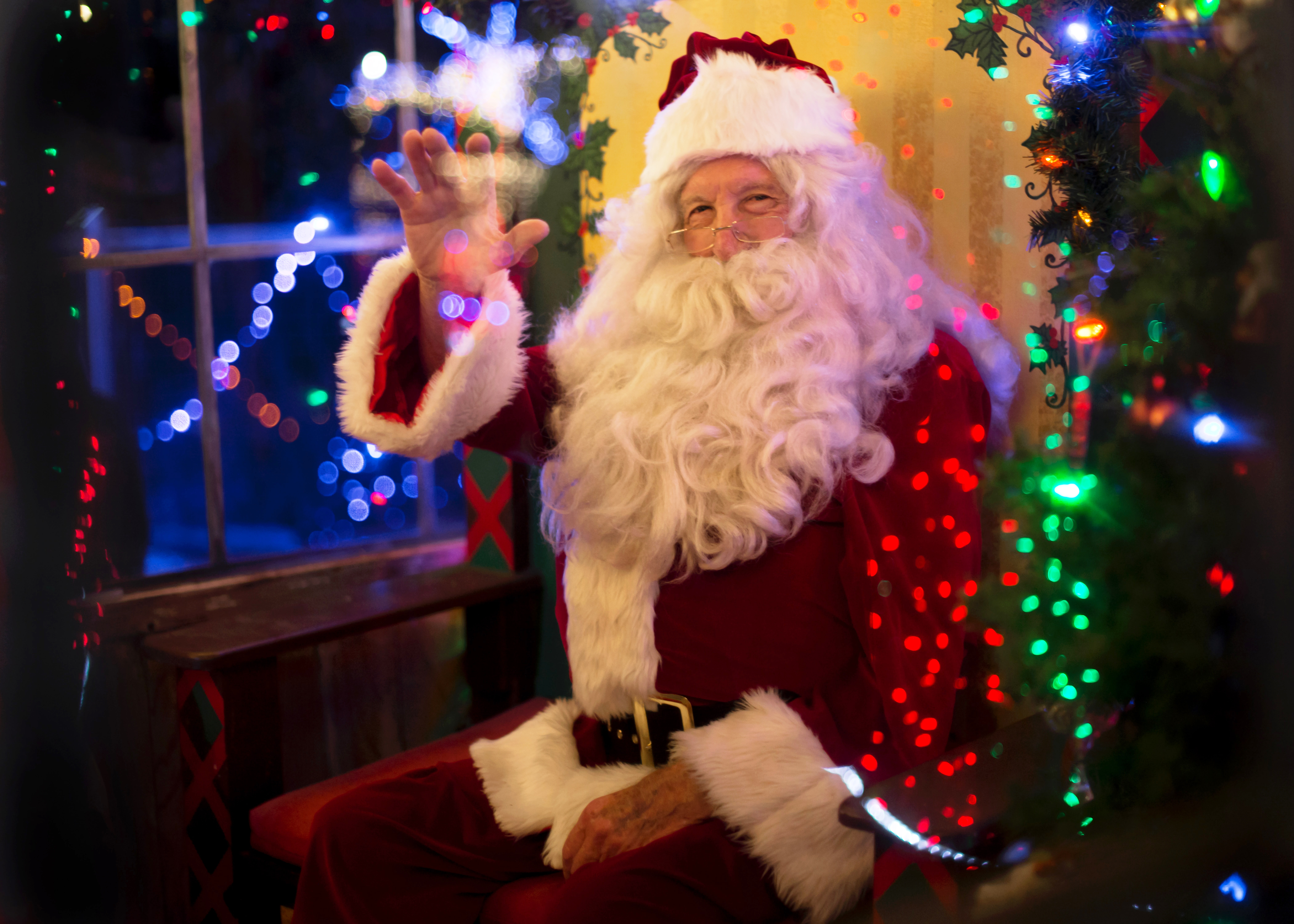 Santa Claus surrounded by lights
