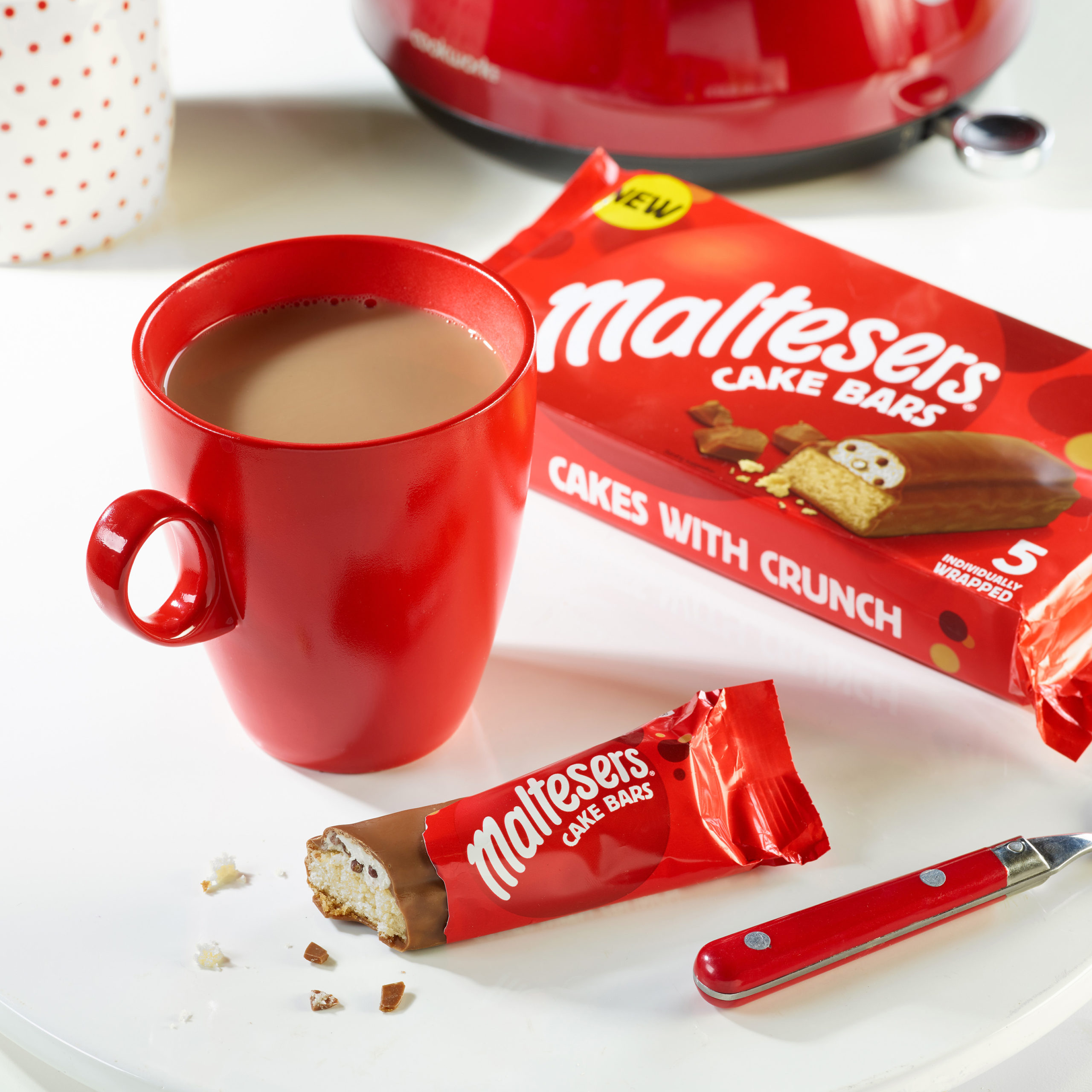 maltesters cake bars next to a cup of tea