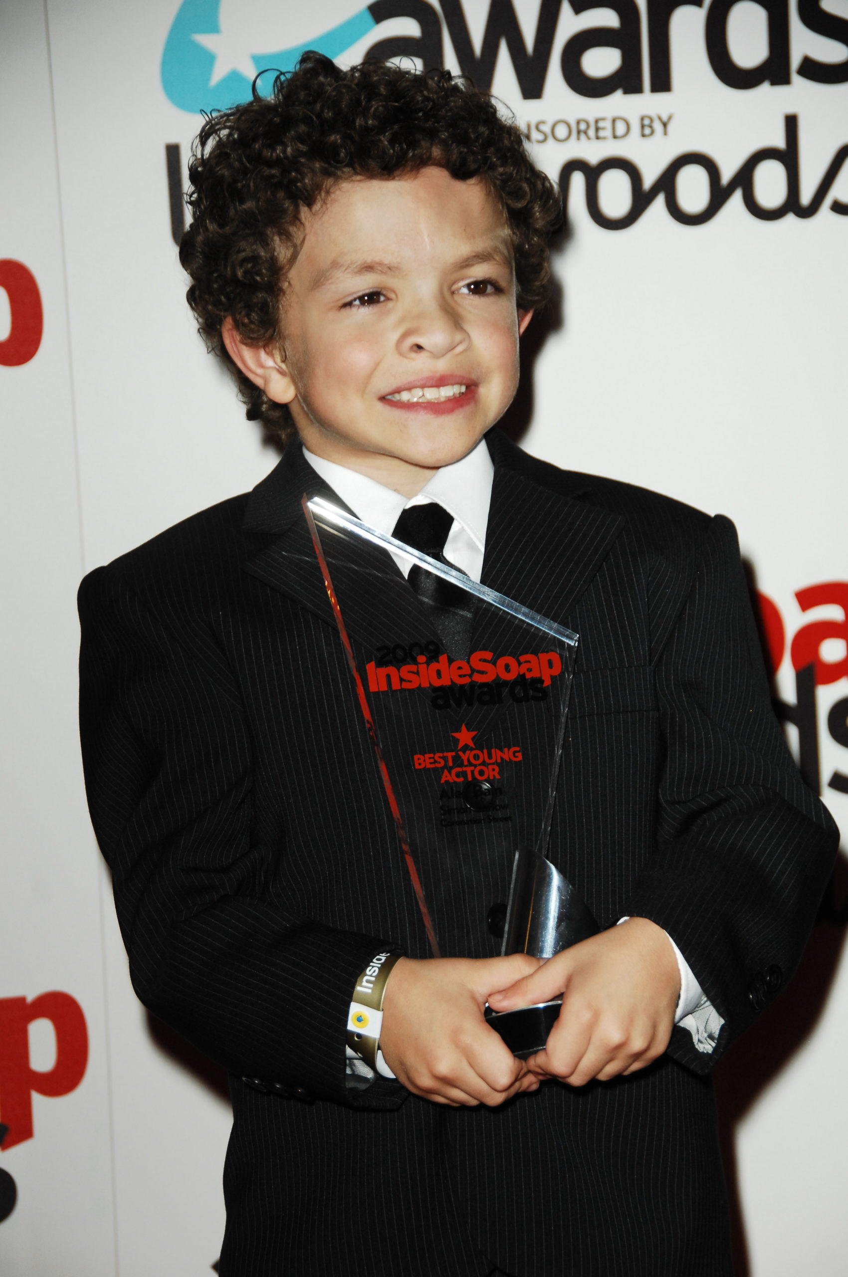 Young Alex Bain clutches his Inside Soap Award after winning Best Young Actor