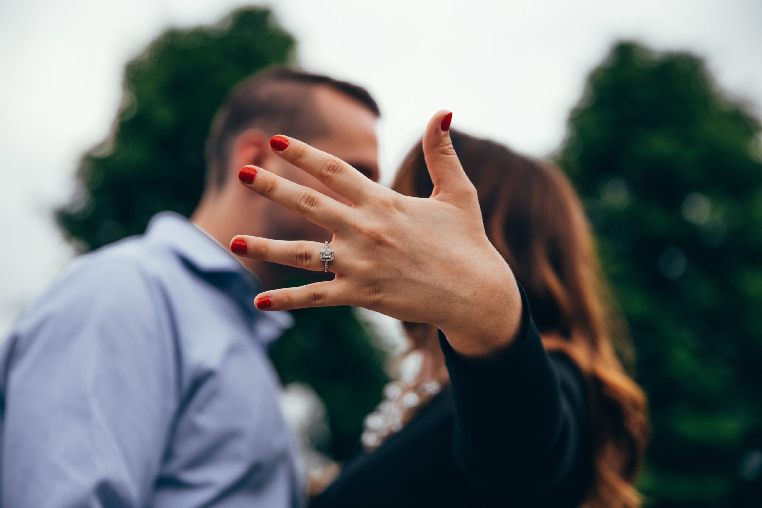 woman showing off engagement ring