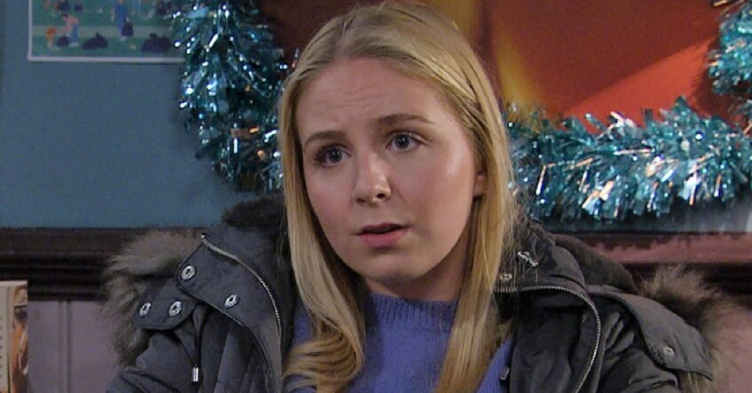 Emmerdale Belle Dingle looks worried as she talks to Nate in the cafe