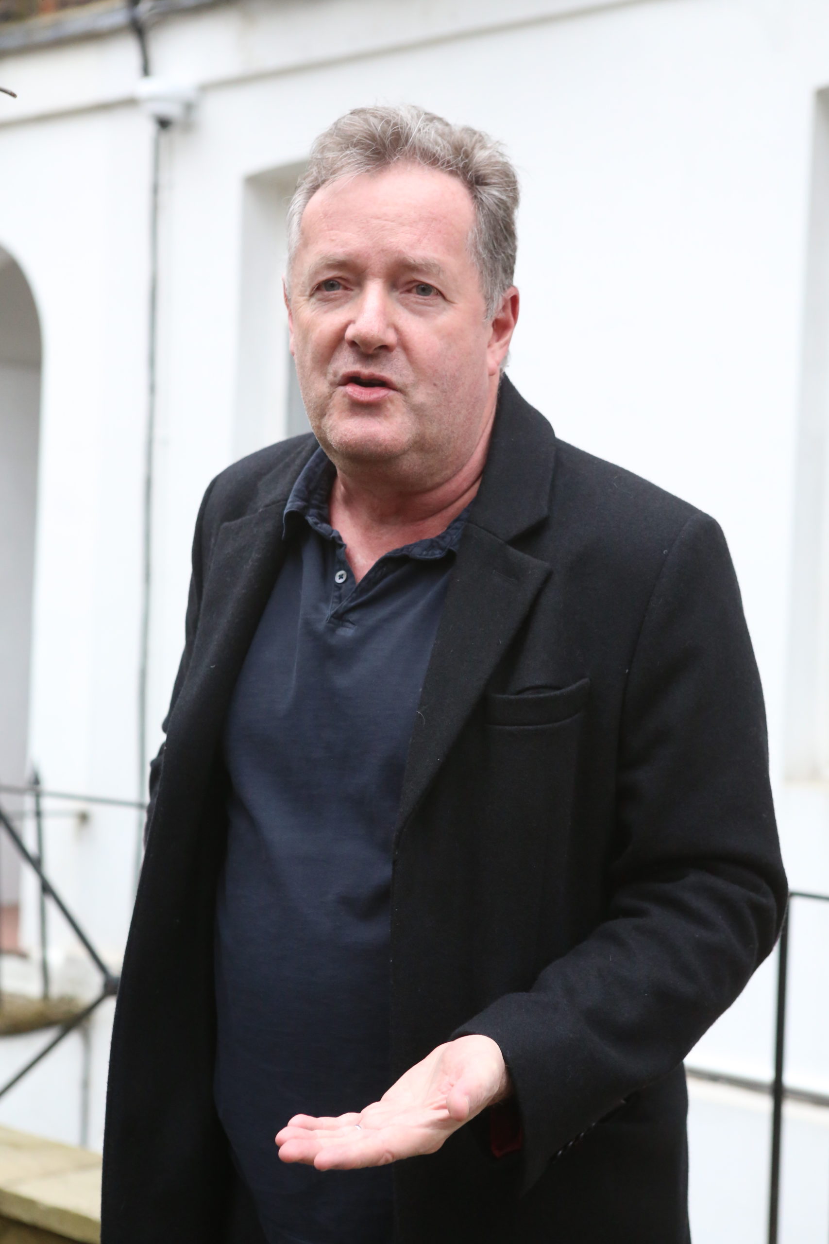 Piers Morgan outside his house