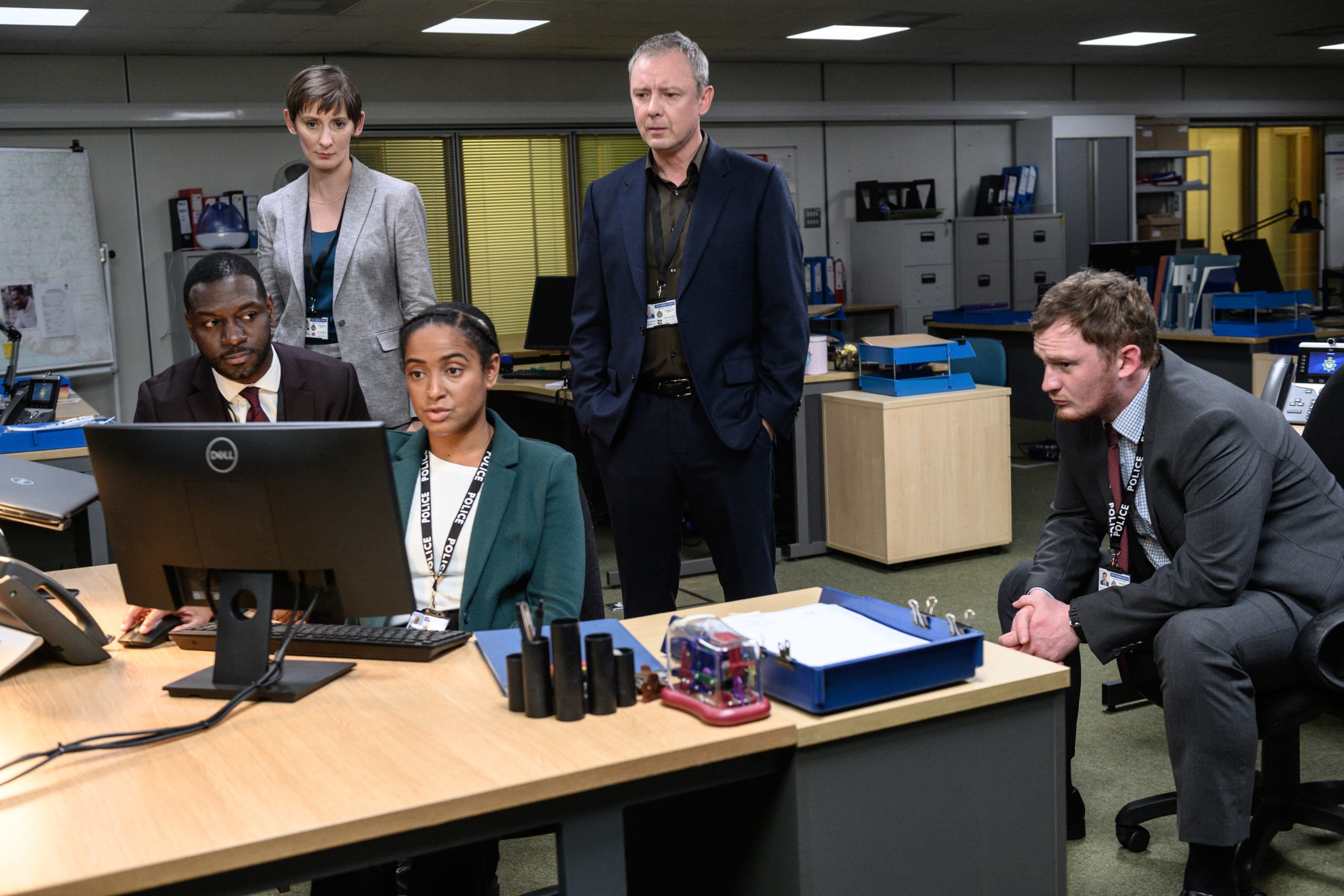 Grace kicked off with its first film entitled Dead Simple, based on the Peter James book of the same name (Credit: ITV1) Pictured:JOHN SIMM as DS Roy Grace,RICHIE CAMPBELL as DS Branson LAURA ELPHINSTONE as DS Moy,AMAKA OKAFOR as DC Boutwood and BRAD MORRISON as DC Nicholl. This image is the copyright of ITV and may only be used in direct relation to Grace series 1,2021.