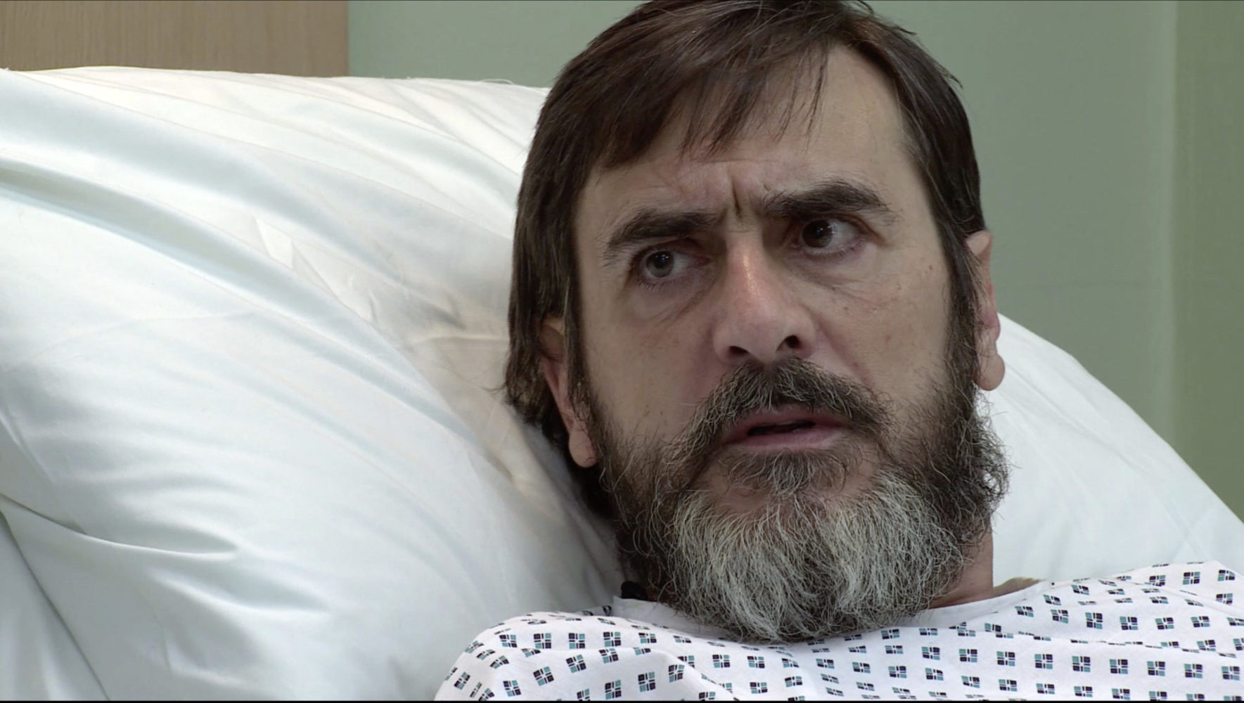 Peter's no longer the angry loverat he once was and he looks stunned in his hospital bed (Credit: ITV)