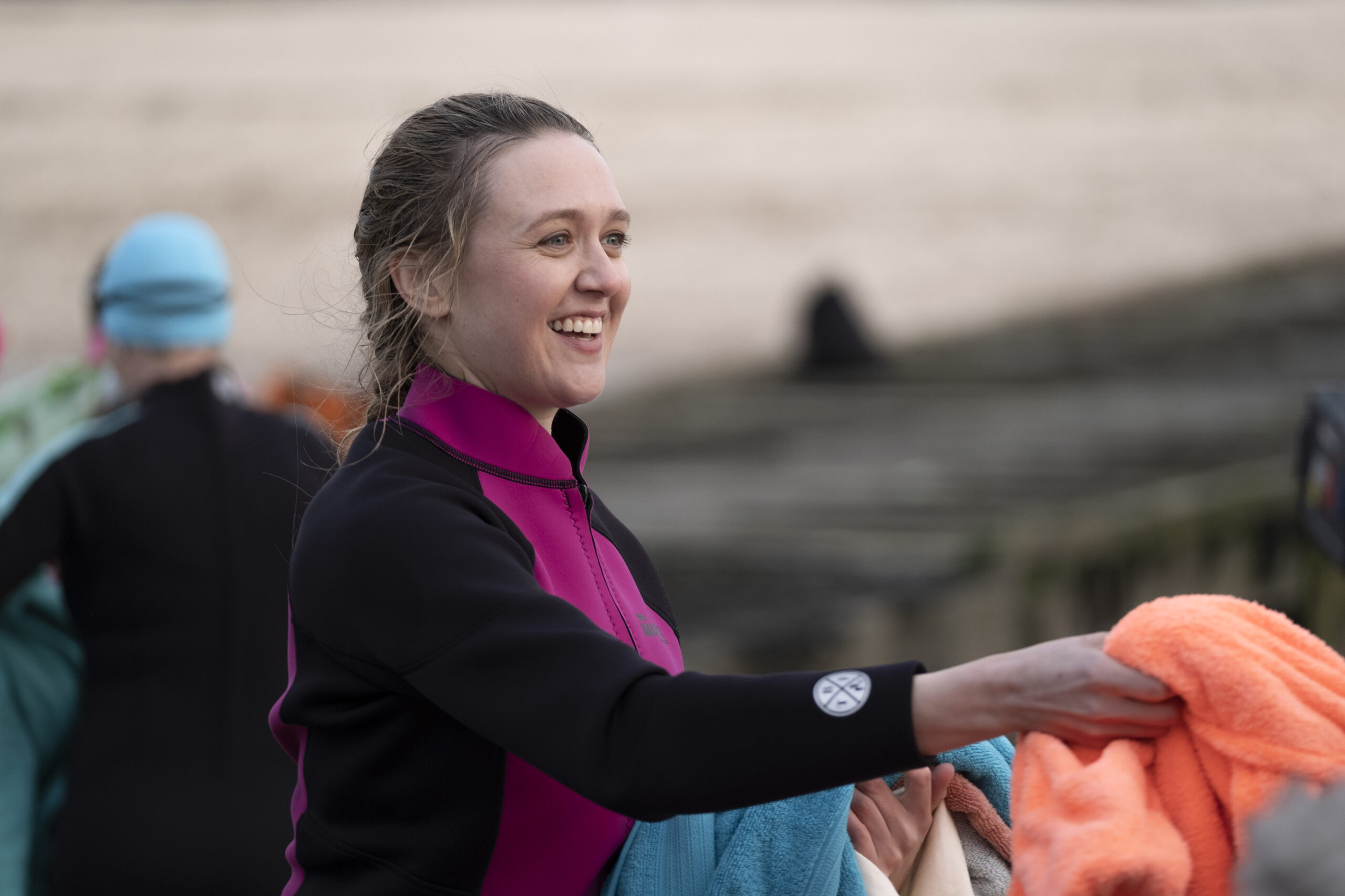 Kat shakes hands with Mike on the beach in Whitstable Pearl