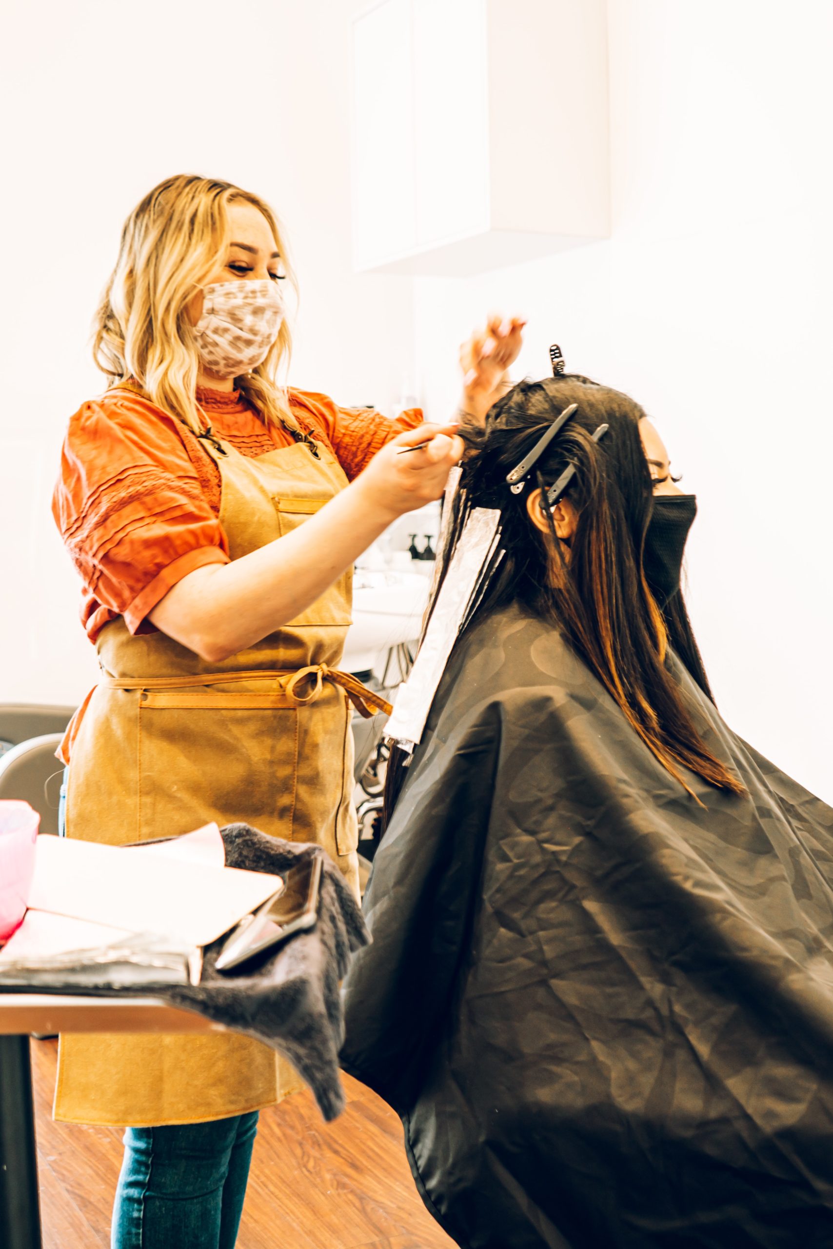 woman cutting someone's hair