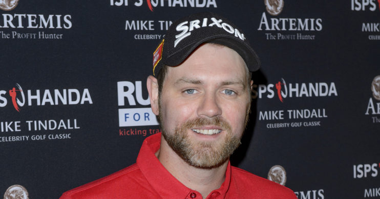 Brian McFadden posing wearing a cap