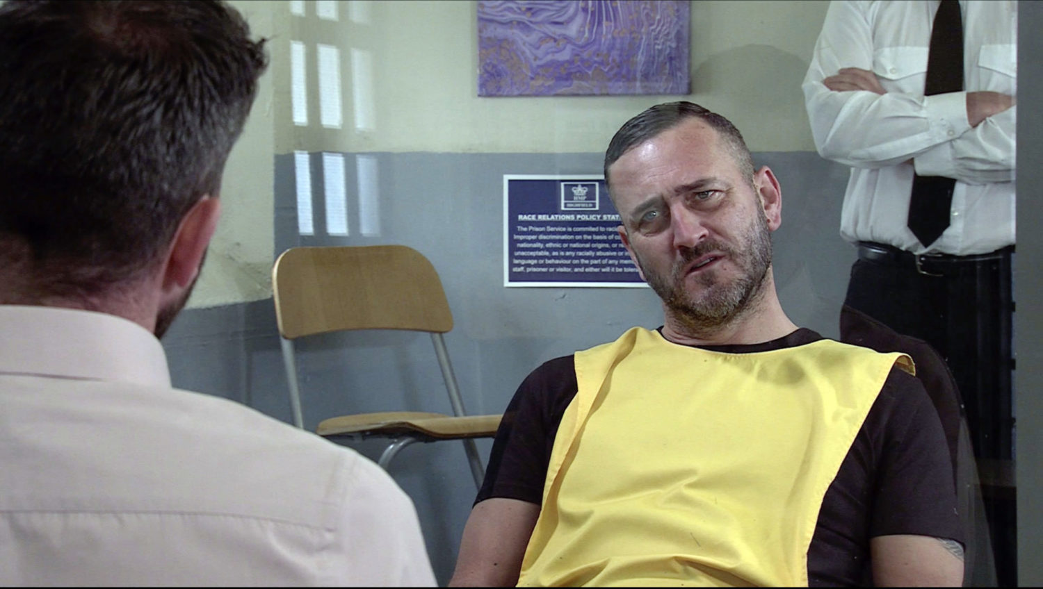 Harvey in prison looking annoyed Corrrie
