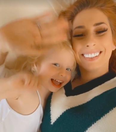 Stacey Solomon and her son Rex wave good morning