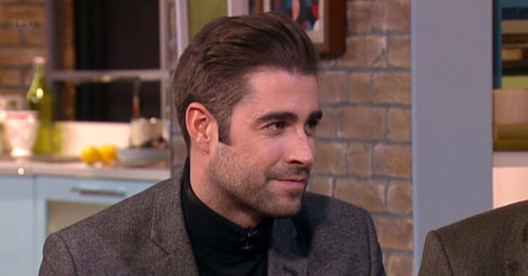 Matt Johnson smiling during TV appearance
