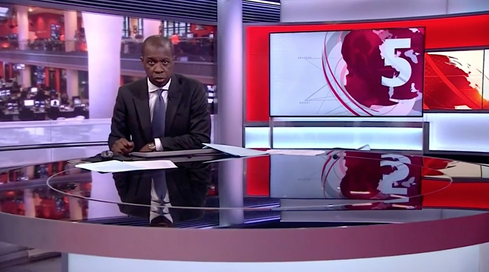 Mastermind host Clive Myrie in his role as BBC News presenter