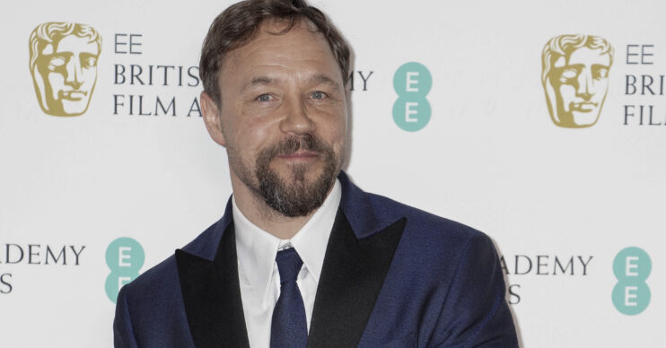 Stephen Graham smiling at the BAFTAS