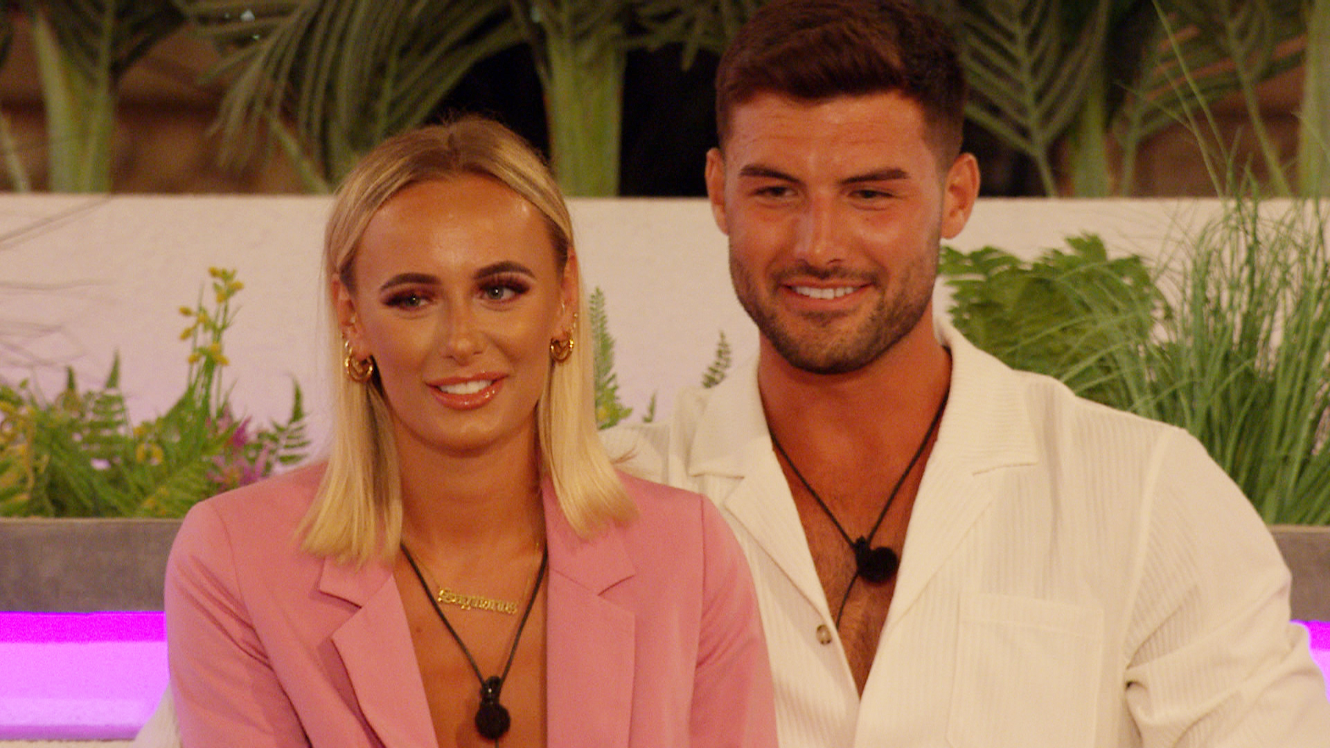  Love Island winners Millie Court and Liam Reardon sit at the firepit