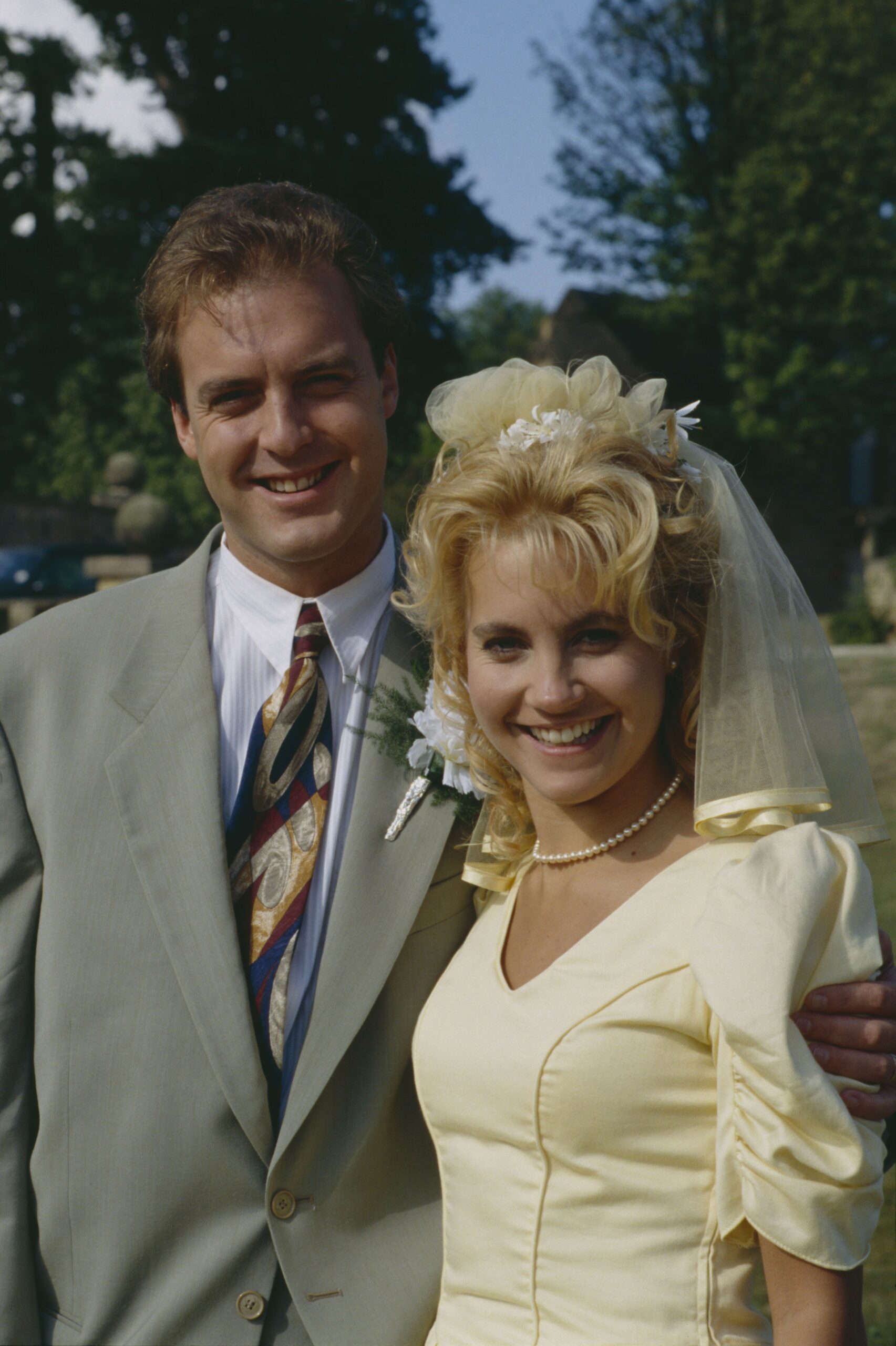 Chris Tate weds Kathy Glover and they smile brightly for pictures