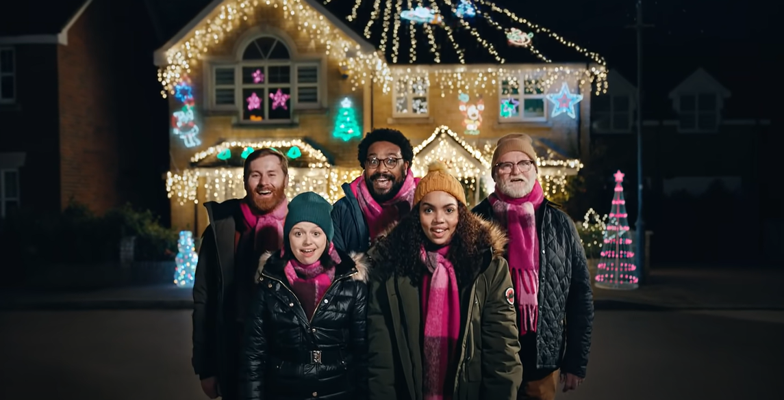 Very's Christmas ad shows carollers outside a decorated house