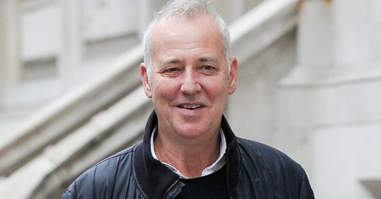 Michael Barrymore smiles as he's seen out and about