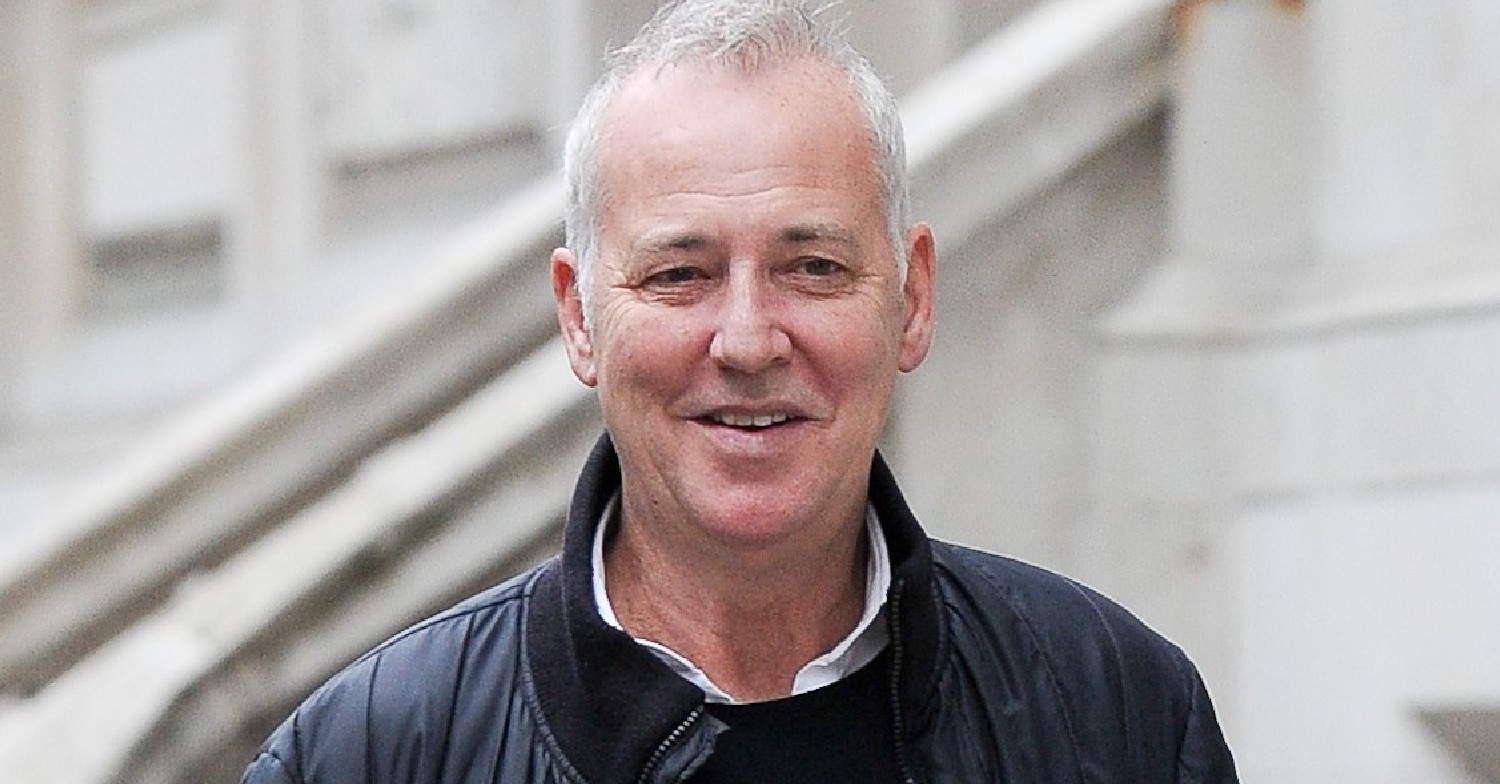 Michael Barrymore smiles as he's seen out and about