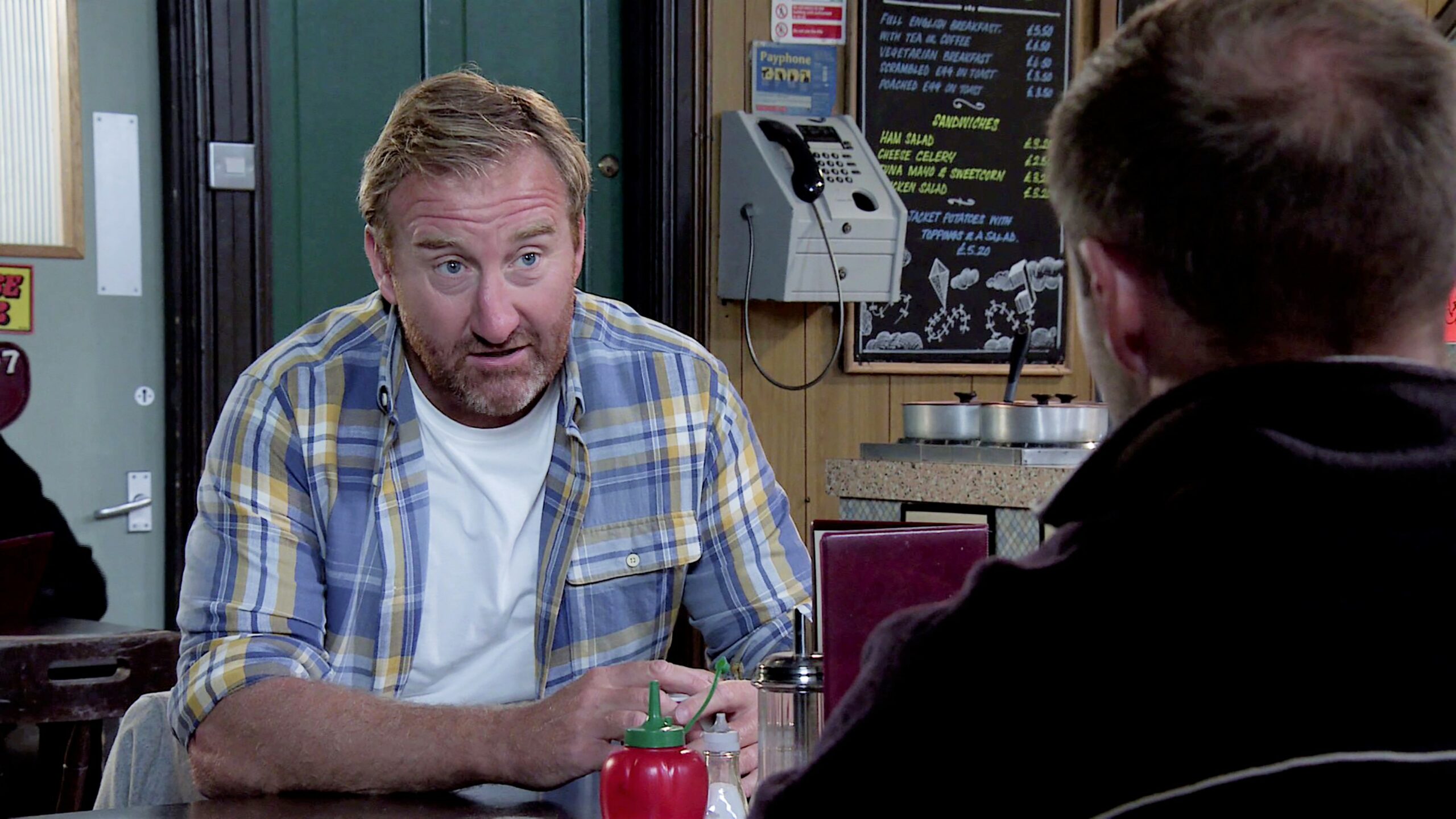 Phill in the cafe Coronation Street