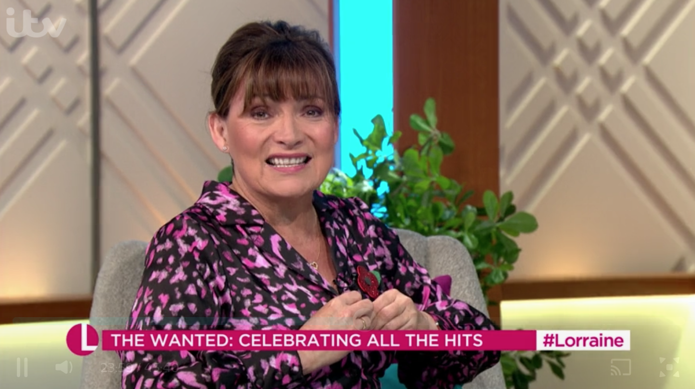 Lorraine Kelly was left red-faced today when a button on her top popped open
