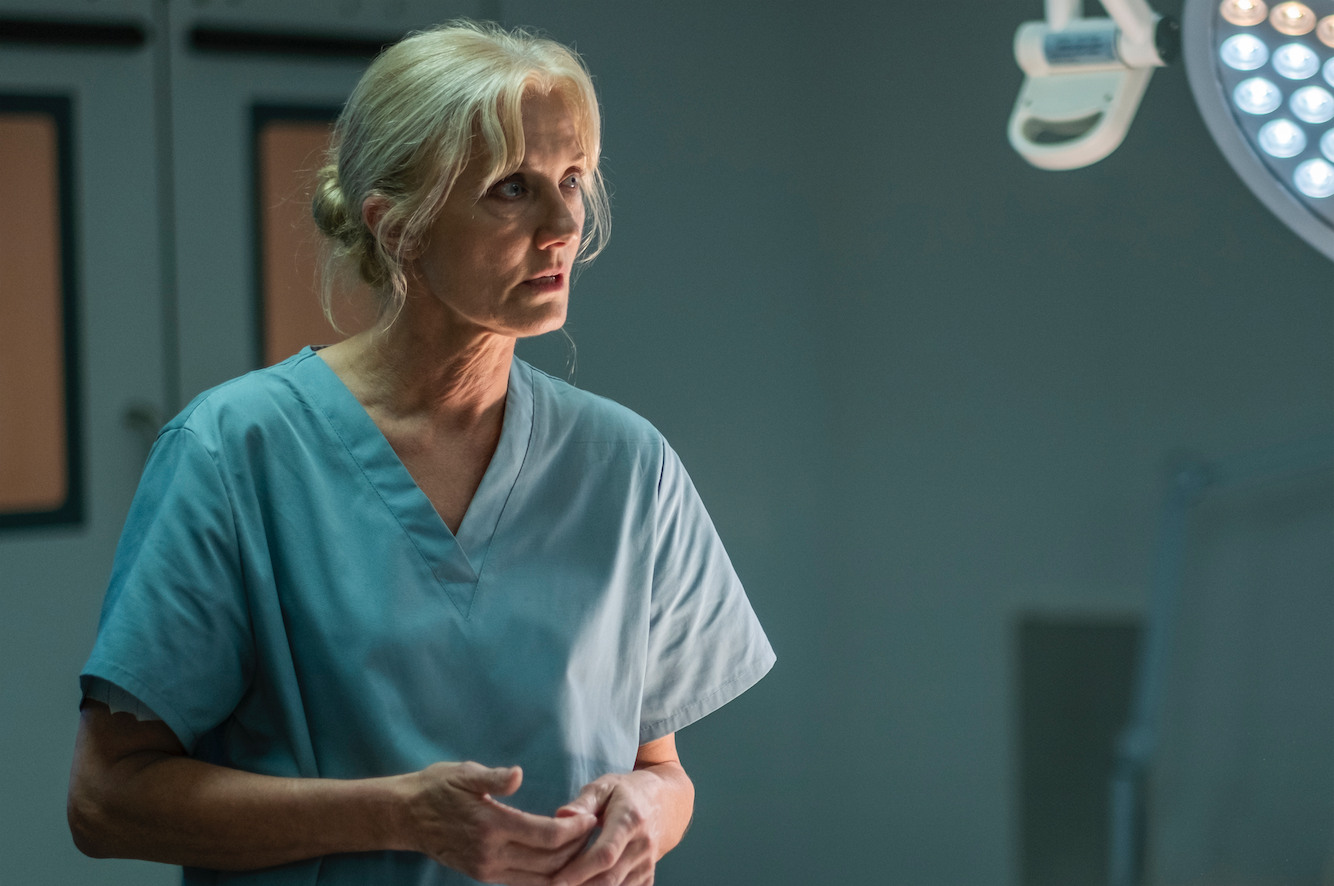 Joely Richardson as a lab technician in scrubs